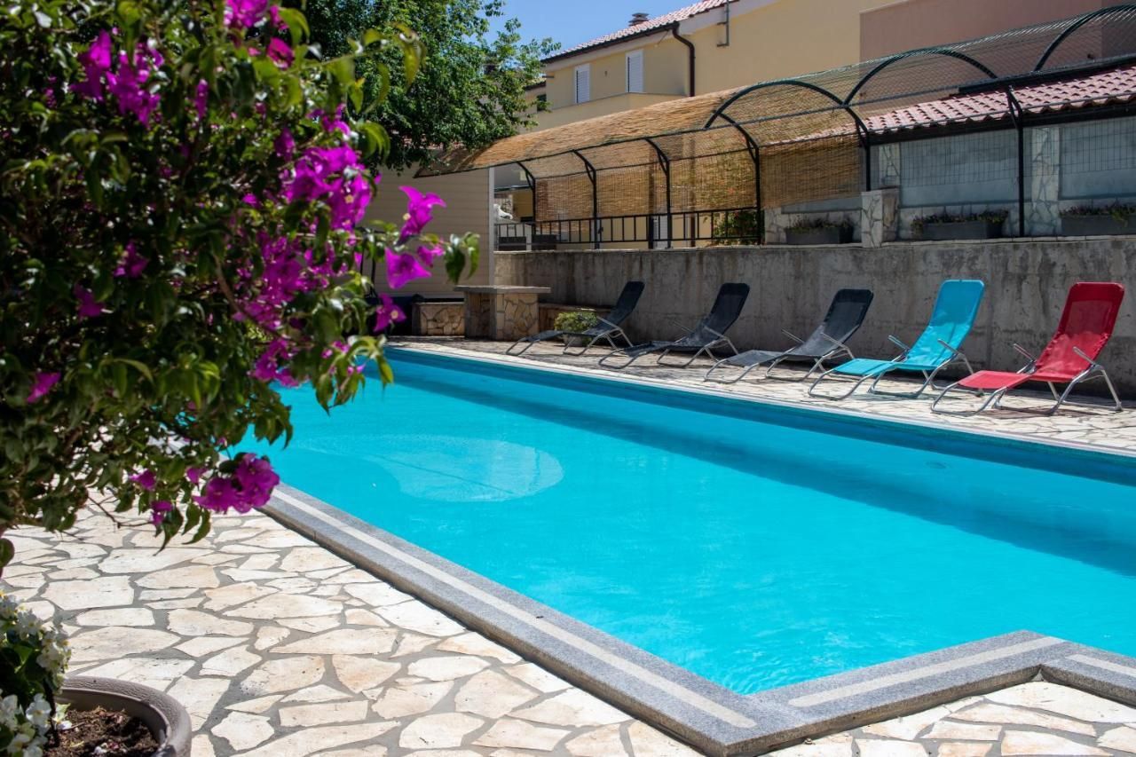 Apartmány s bazénem